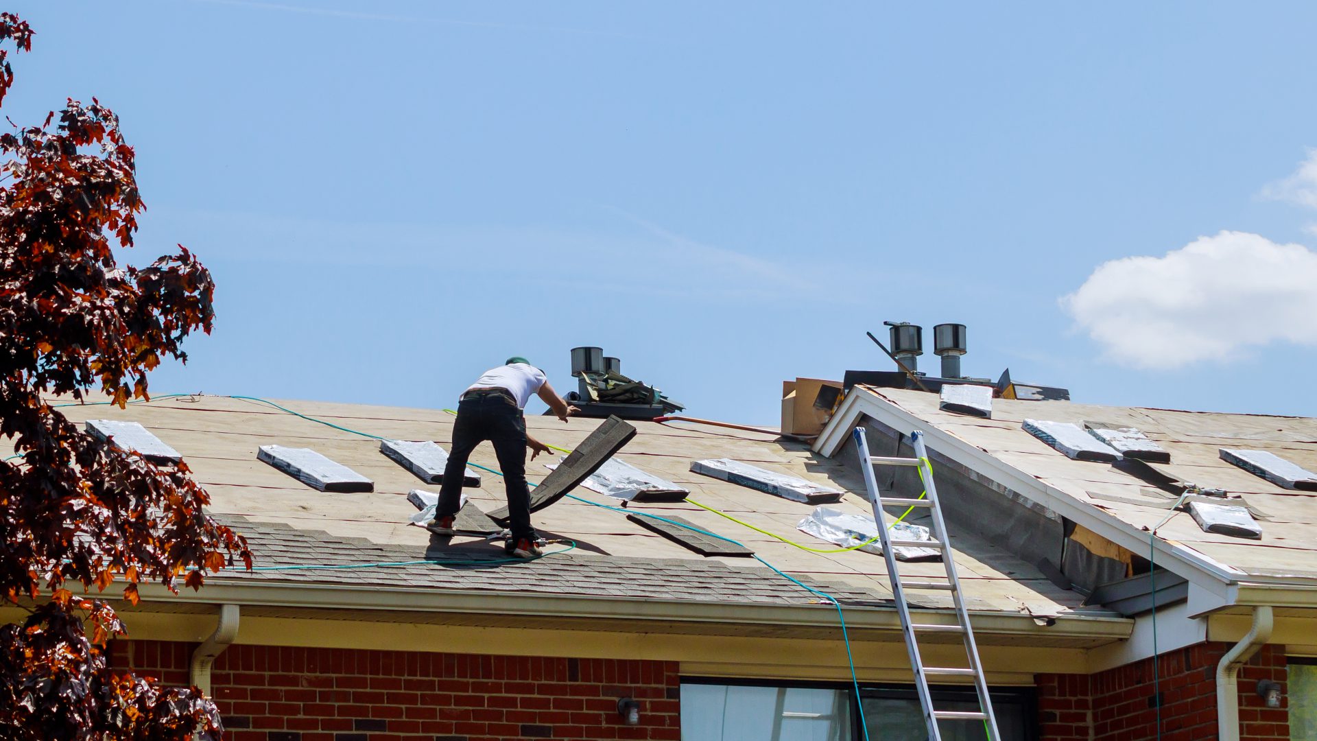 CCY crew applying new shingles on a CSRA home