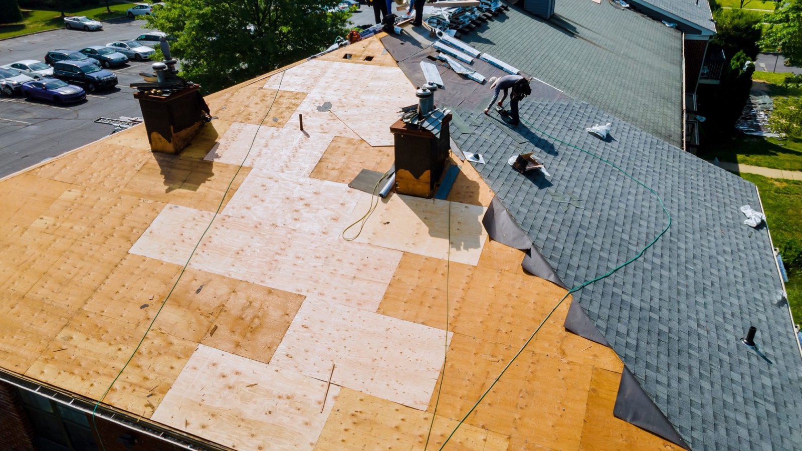Old roof replaced with new shingles after a storm claim